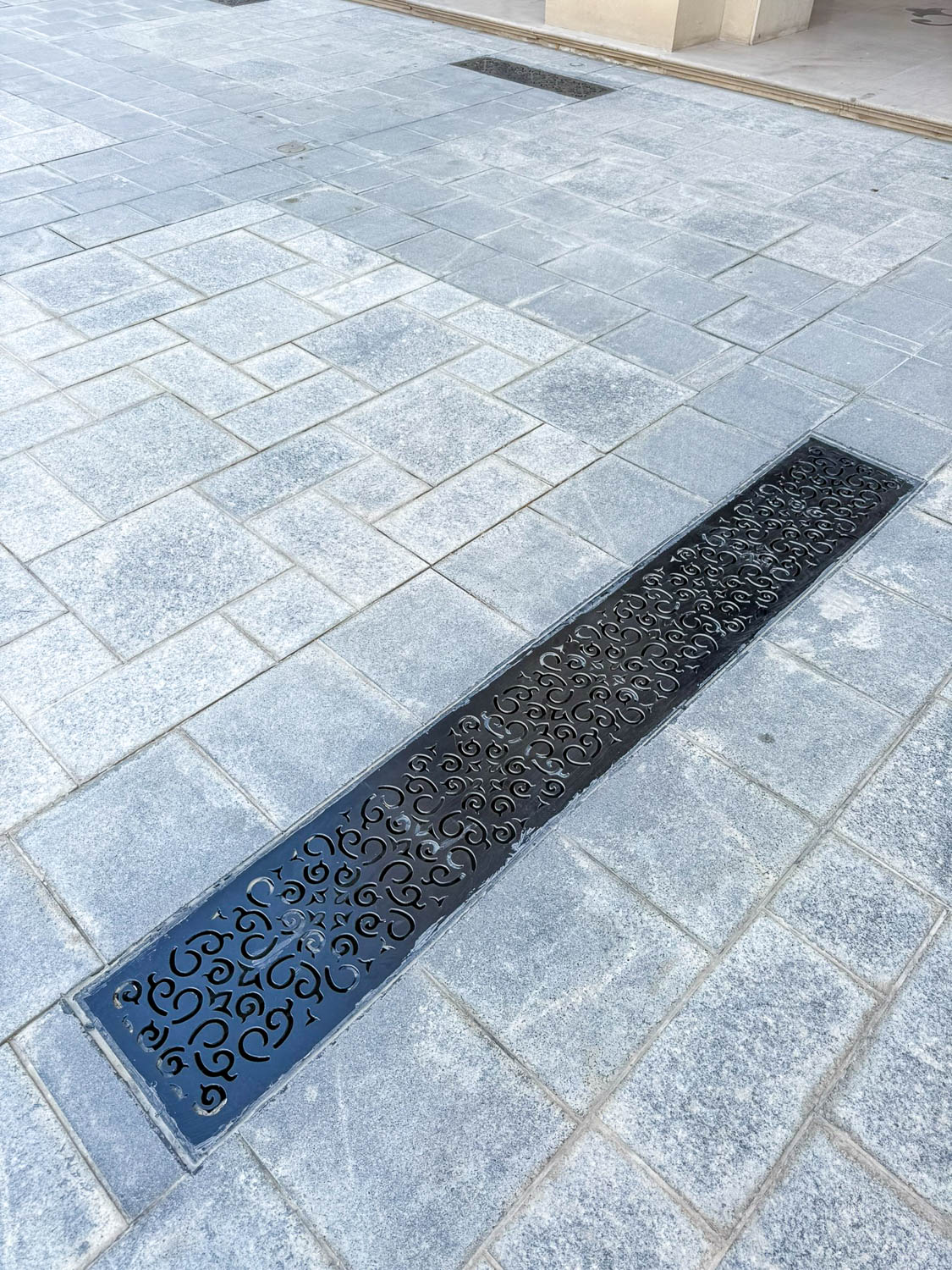 Outdoor air-conditioning vents along 21 High Street at Katara Cultural Village