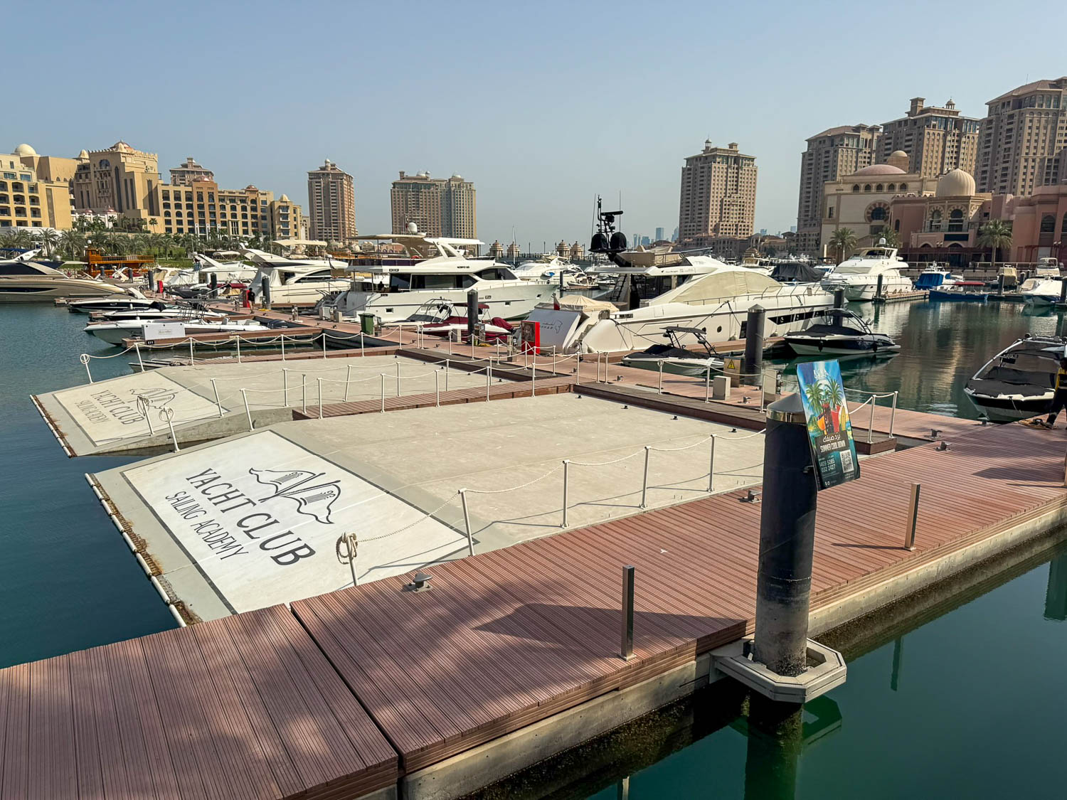 Luxury yachts docked at Porto Arabia marina in The Pearl Qatar