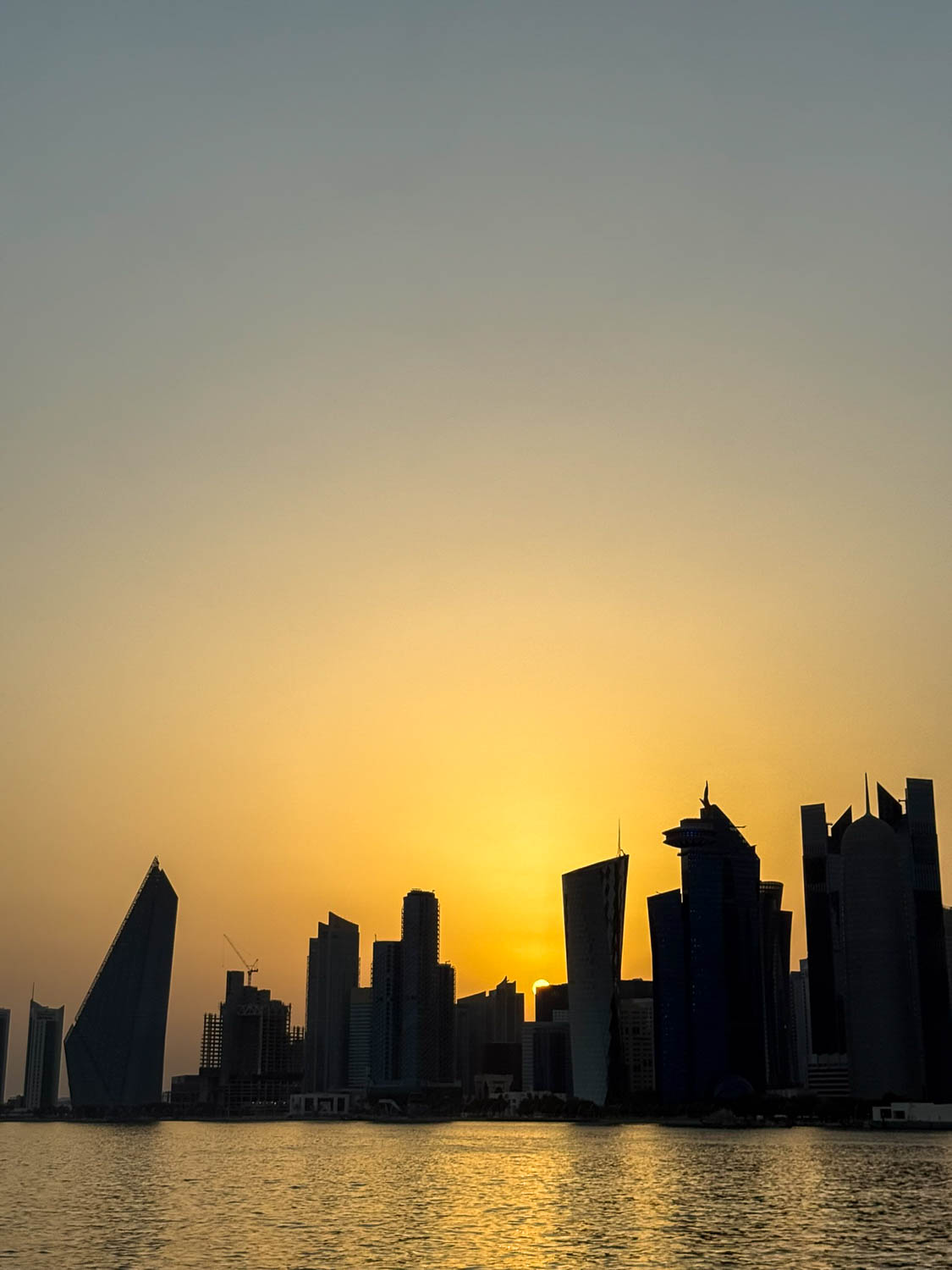 Sunset view of West Bay skyline from a dhow cruise in Doha Qatar