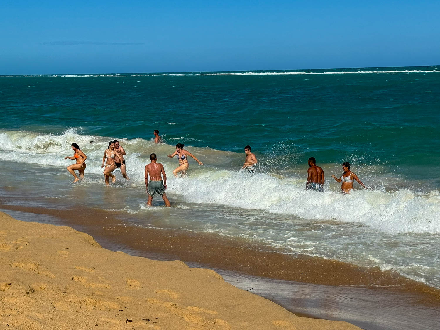 Personal belongings left on the beach in Maceió Brazil demonstrating common travel safety precautions