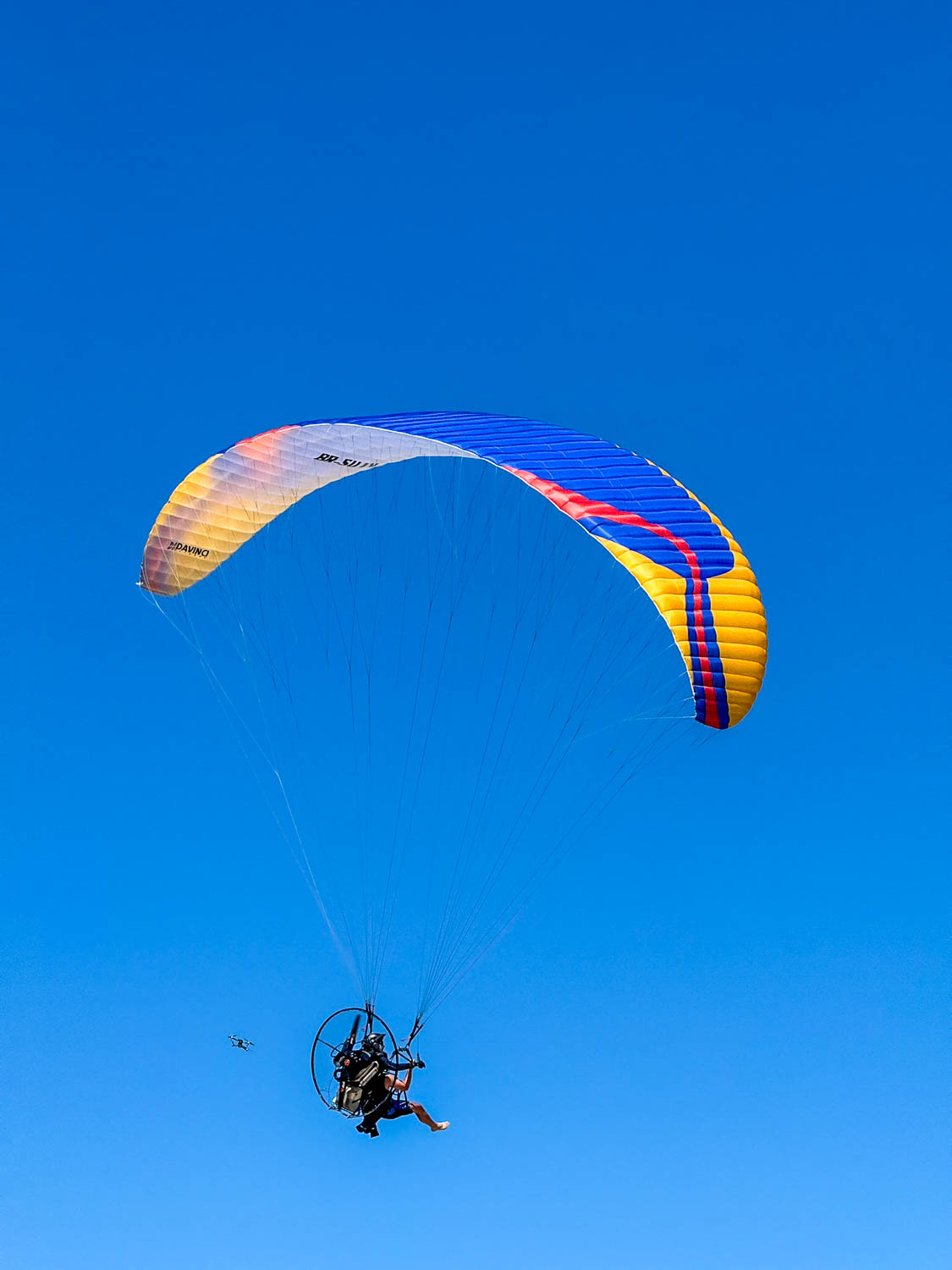 Paramotor flight launching from the sand at Gunga Beach near Maceio Brazil