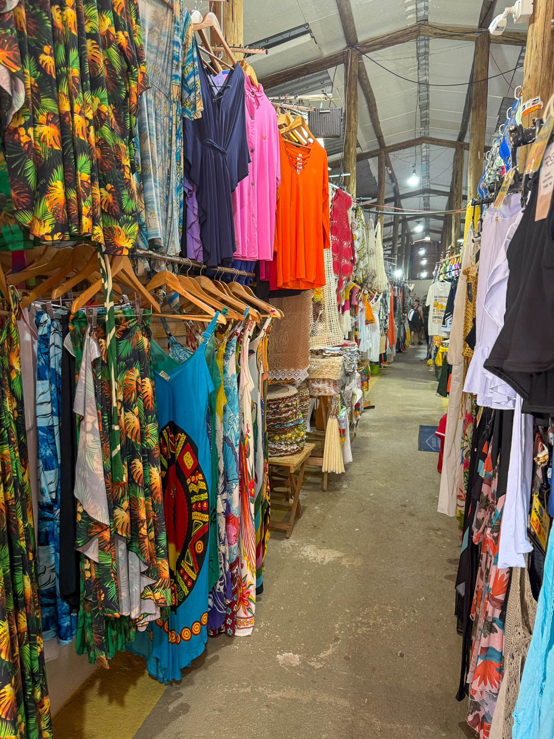 Travelers exploring a local market while shopping in Maceio Brazil