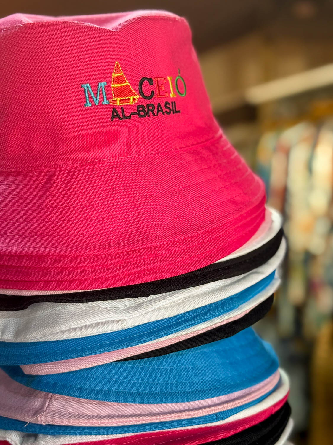 Traveler enjoying a sunny day in Maceió Brazil with proper sun protection while exploring the coastline